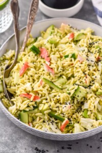 bowl of California Roll Pasta Salad with two spoons for serving