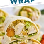 Pinterest graphic for Chicken Caesar Wrap recipe. Text says, "the best Chicken Caesar Wrap simplejoy.com." Image shows a Chicken Caesar Wrap cut in half and stacked on top of each other with cherry tomatoes beside.