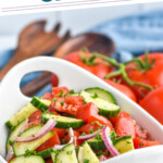 Pinterest graphic for Cucumber Tomato Salad. Text says "the best Cucumber Tomato Salad simplejoy.com" Image shows bowl of Cucumber Tomato Salad with fresh tomatoes and utensils sitting behind.