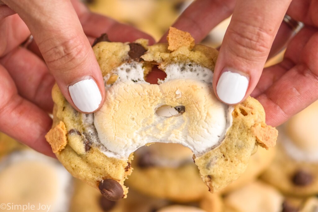 Close up view of person's hands pulling apart a S'mores Cookie