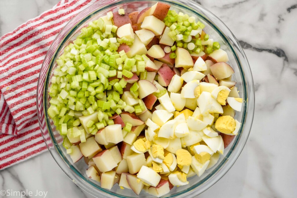 overhead of bowl of potato salad ingredients