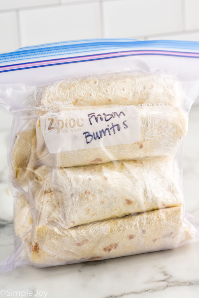 Ziplock bag of breakfast burritos labeled "frozen burritos"