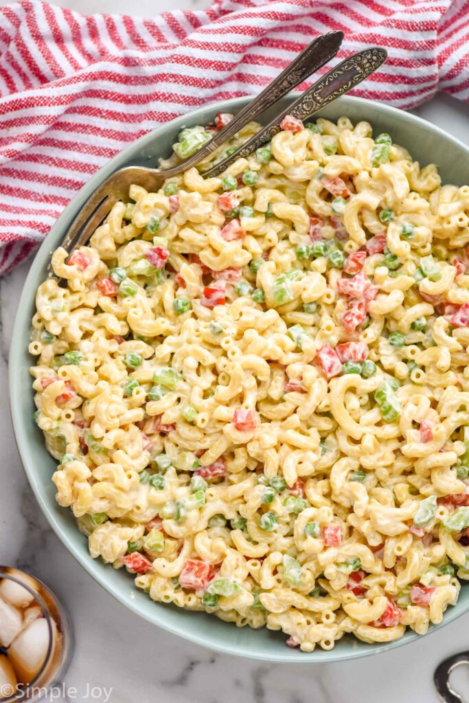 Overhead of bowl of Macaroni Salad with two forks for serving