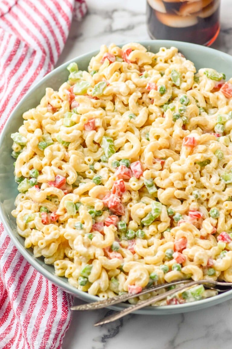 Bowl of Macaroni Salad with two spoons for serving