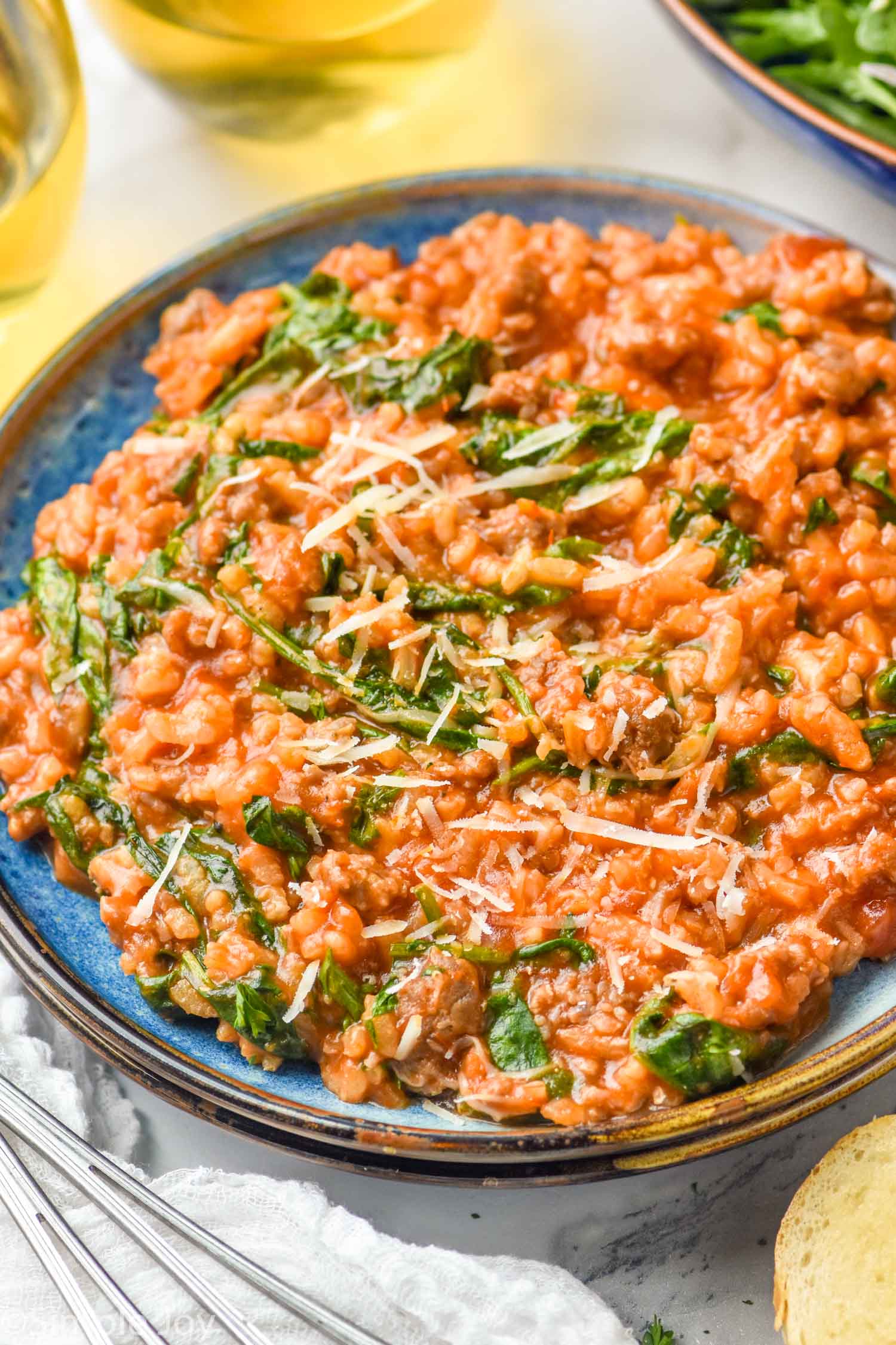 Plate of risotto topped with parmesan cheese