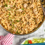 Pinterest graphic for Beef Stroganoff. Image shows overhead of skillet of Beef Stroganoff, text says " absolutely delicious Beef Stroganoff simplejoy.com"