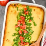 Pinterest image for Tamale Pie. Text says "the best Tamale Pie simplejoy.com" Image shows overhead of casserole dish of Tamale Pie topped with chopped lettuce, tomatoes, and jalapenos.