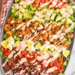 overhead of Cajun Cobb Salad topped with cajun ranch dressing