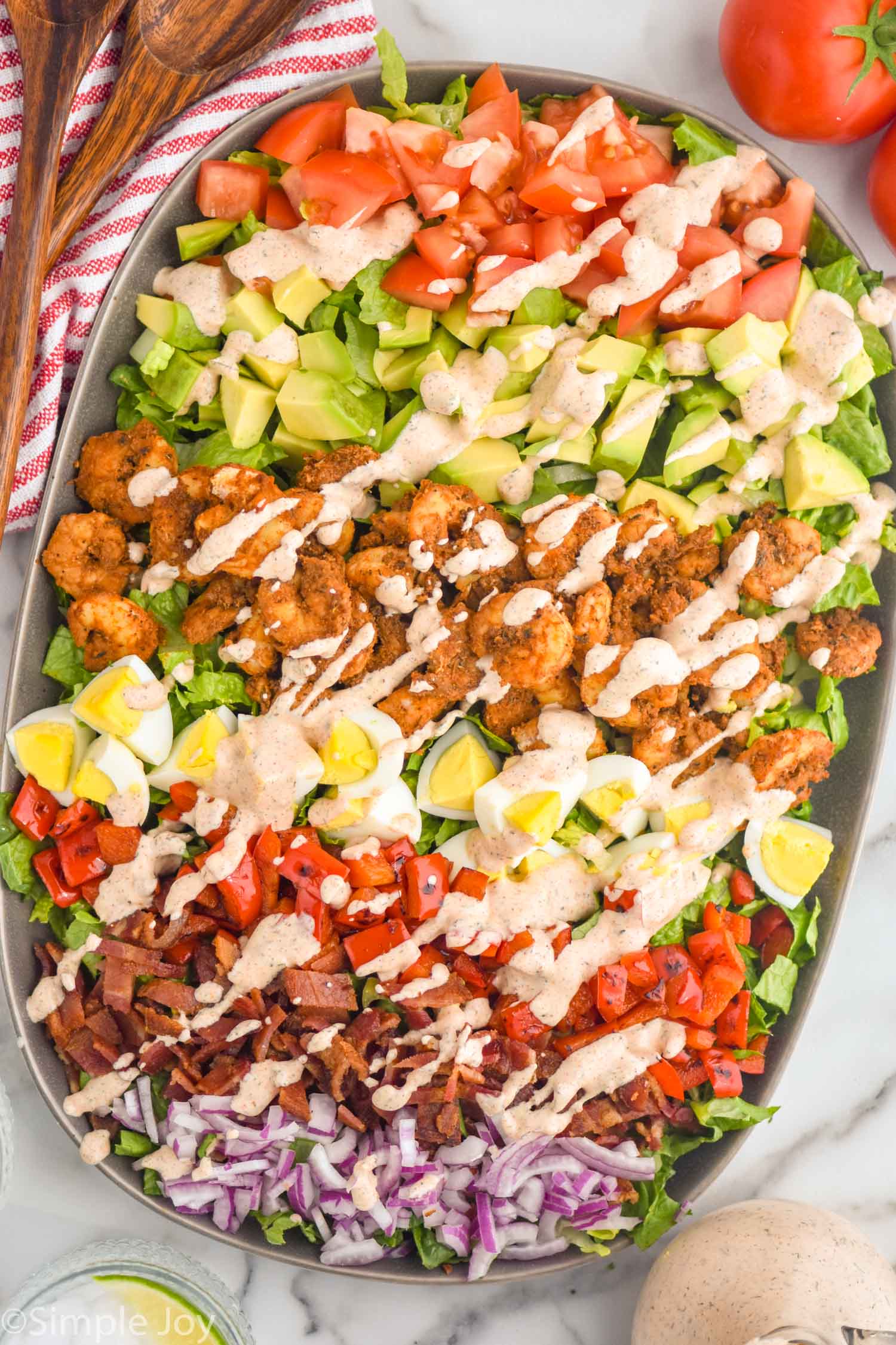 overhead of Cajun Cobb Salad topped with cajun ranch dressing