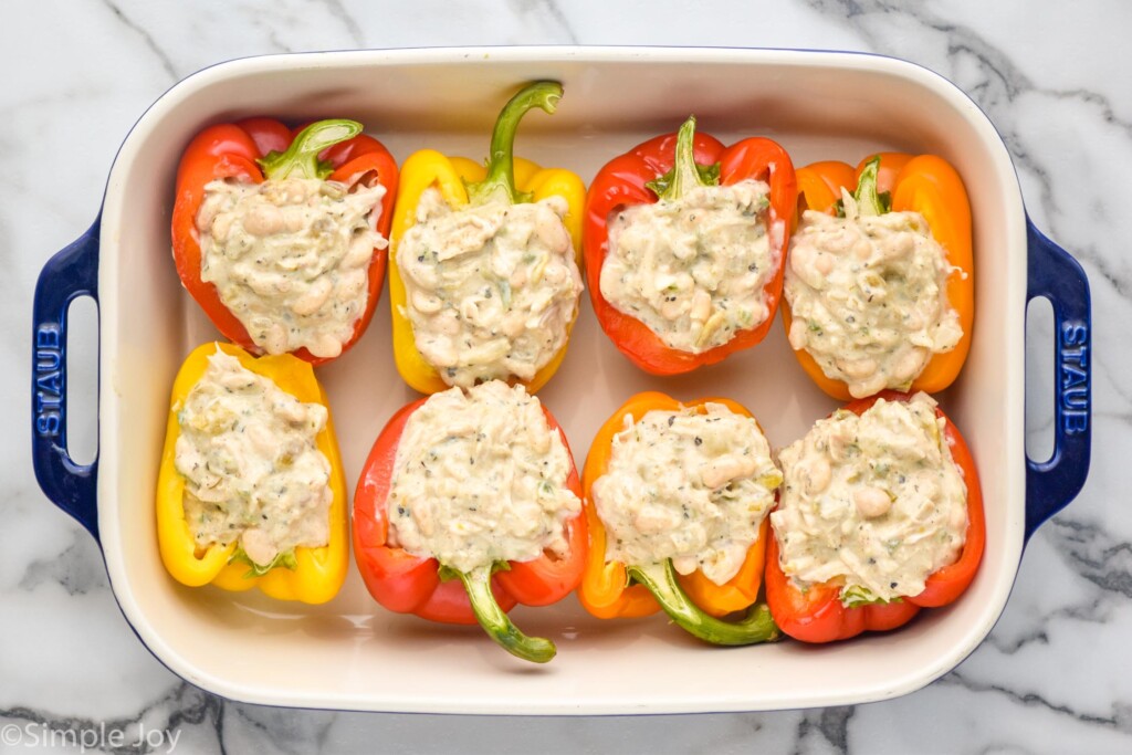 overhead of baking dish of White Chicken Chili Stuffed Peppers