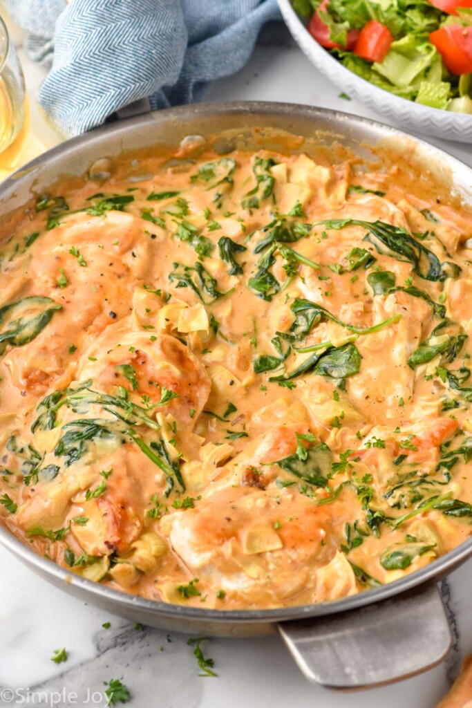 skillet of Spinach Artichoke Chicken with sauce