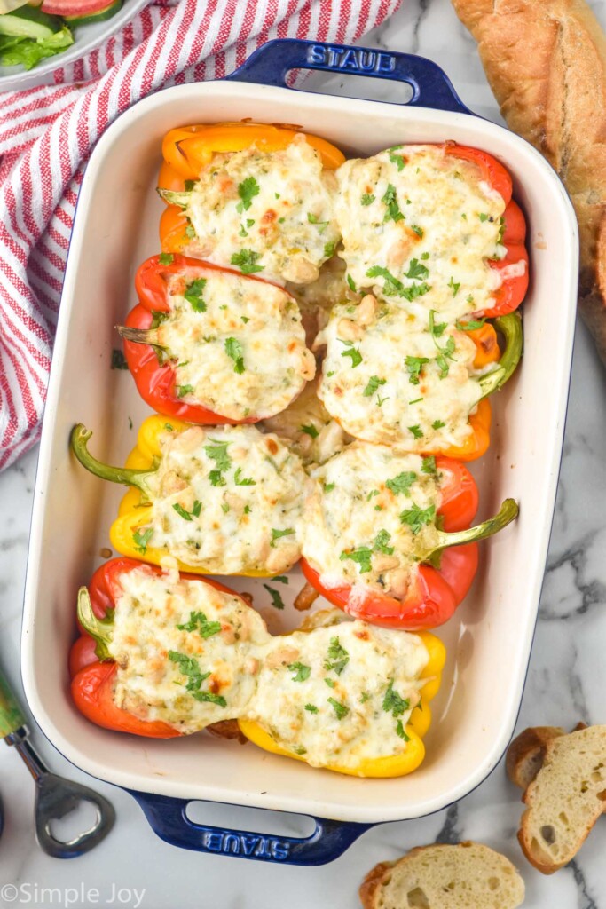 overhead of White Chicken Chili Stuffed Peppers in a baking dish topped with fresh parsley