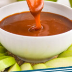 Pinterest graphic for Caramel Apple Dip. Image shows hand holding apple slice dipped in bowl of caramel apple dip. Text says "caramel dip simplejoy.com"