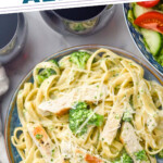 Pinterest graphic for Chicken Broccoli Alfredo. Text says "the best Chicken Broccoli Alfredo simplejoy.com" Image shows overhead of a plate of pasta with alfredo sauce and broccoli, topped with slices of chicken and grated parmesan cheese.