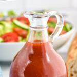 Pinterest graphic for French Dressing. Text says "the best French Dressing simplejoy.com" Image shows bottle of French Dressing with bowl of salad in background