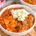 bowl of Lasagna Soup topped with cheese and fresh parsley