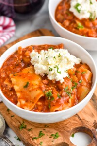 bowl of Lasagna Soup topped with cheese and fresh parsley