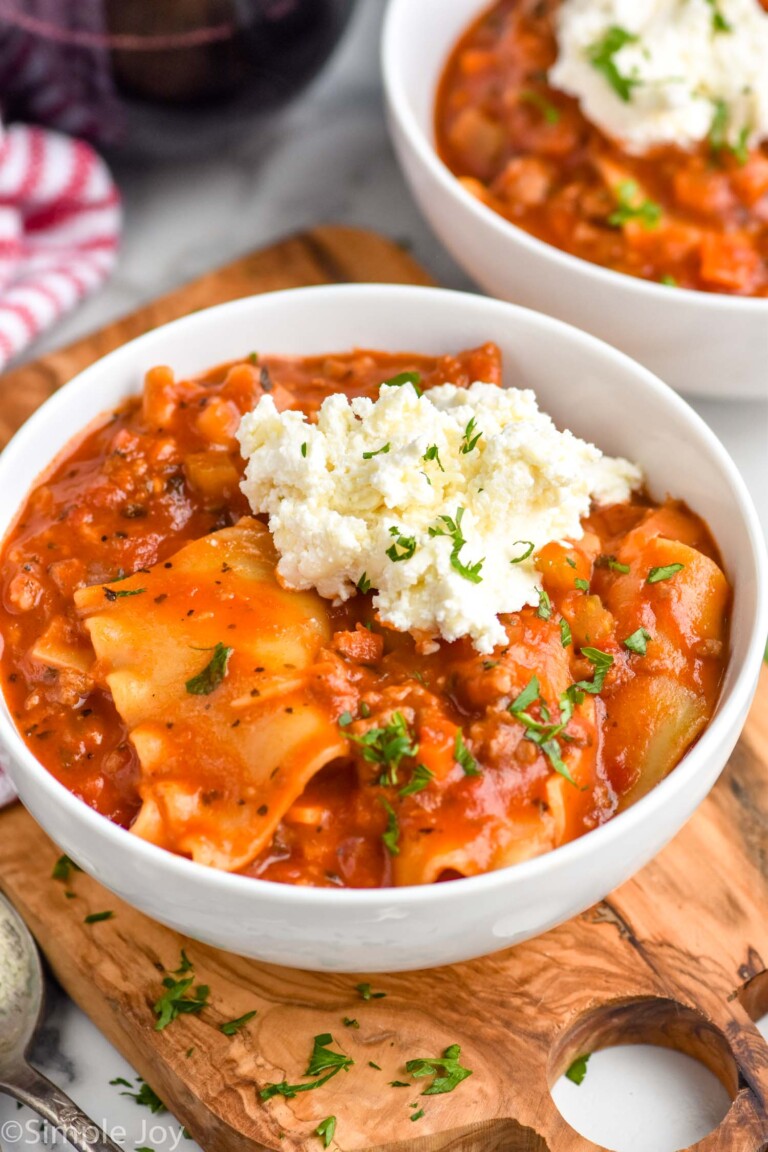 bowl of Lasagna Soup topped with cheese and fresh parsley