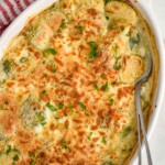 overhead of a Brussel sprout casserole with a spoon in the dish