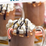 Pinterest graphic for Hot Chocolate. Text says "the best Hot Chocolate recipe simplejoy.com" Image shows a mug of homemade Hot Chocolate topped with marshmallows, chocolate drizzle and a candy cane