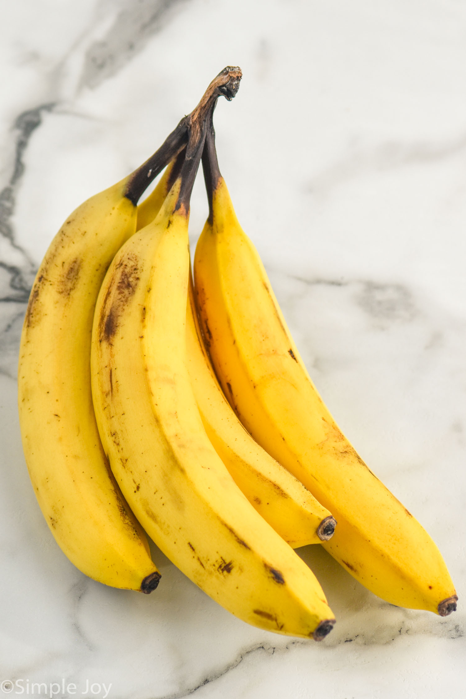 bananas sitting on a counter