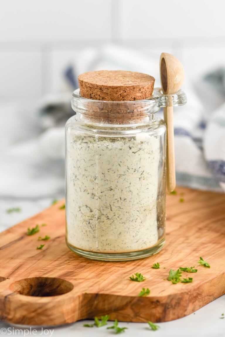 Jar of Homemade Ranch Seasoning with a lid and small wooden spoon.