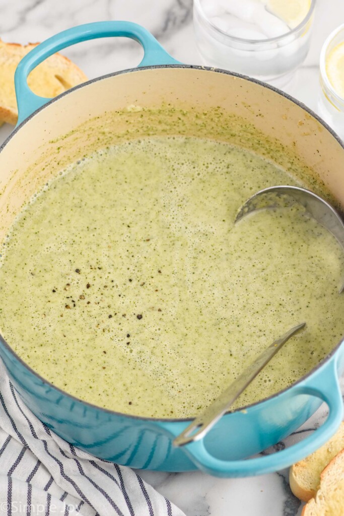 large pot of Cream of Broccoli Soup with a ladle