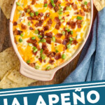 Pinterest graphic for Jalapeño Popper Dip. Image shows overhead of dish of Jalapeño Popper Dip topped with diced bacon and green onion, tortilla chips sitting beside. Says "Jalapeño Popper Dip simplejoy.com"