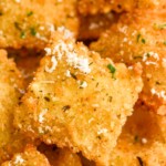 close up of Fried Ravioli topped with grated parmesan cheese