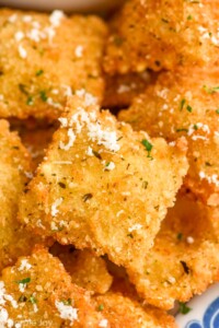 close up of Fried Ravioli topped with grated parmesan cheese