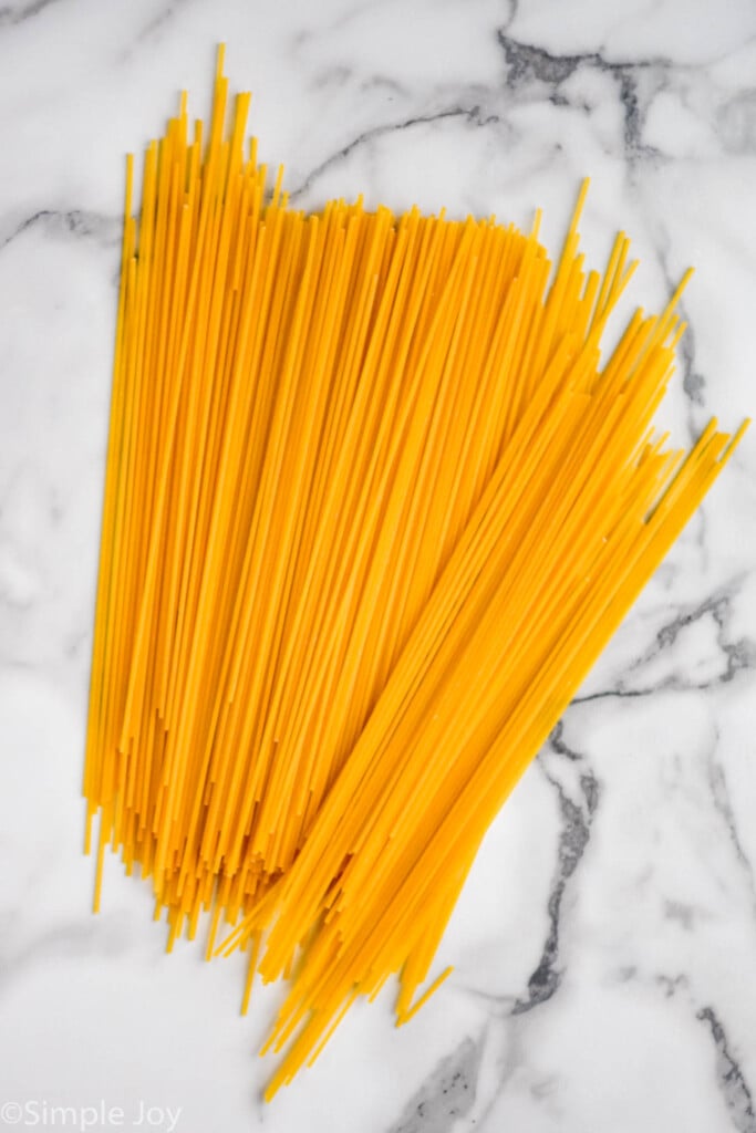 overhead of dry spaghetti sitting on the counter