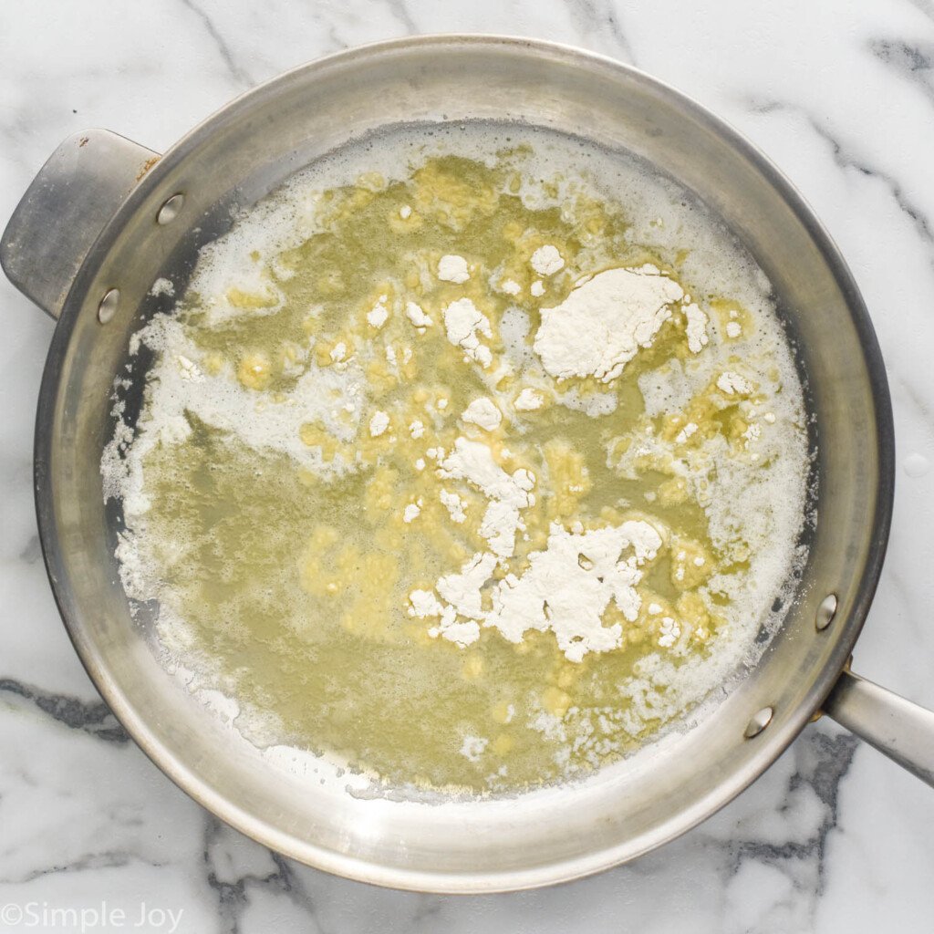 all purpose flour in a pan with melted butter