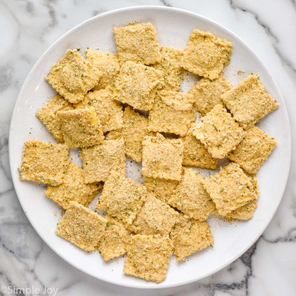 plate of ravioli covered in breadcrumbs to make Fried Ravioli