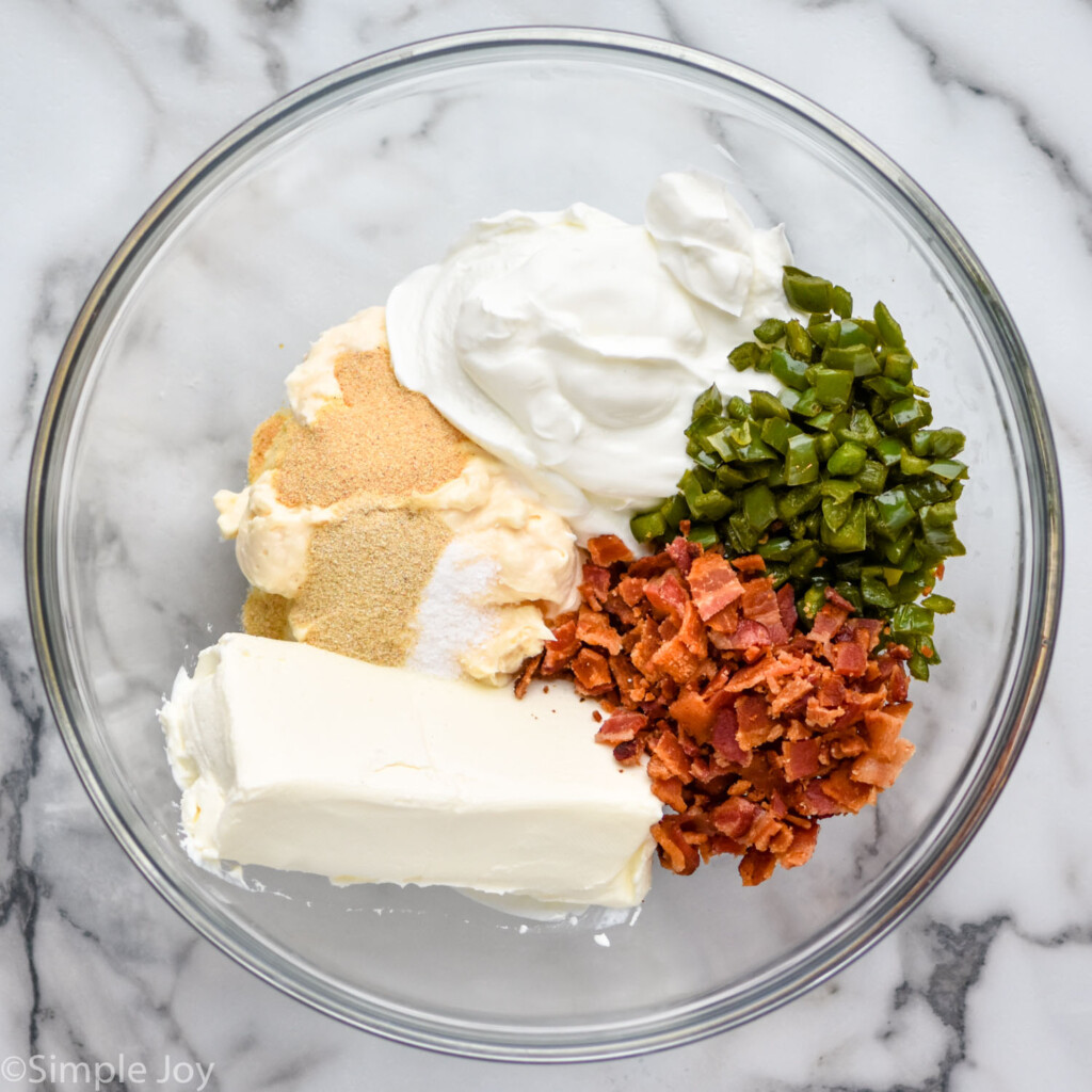 overhead of bowl of Jalapeño Popper Dip ingredients