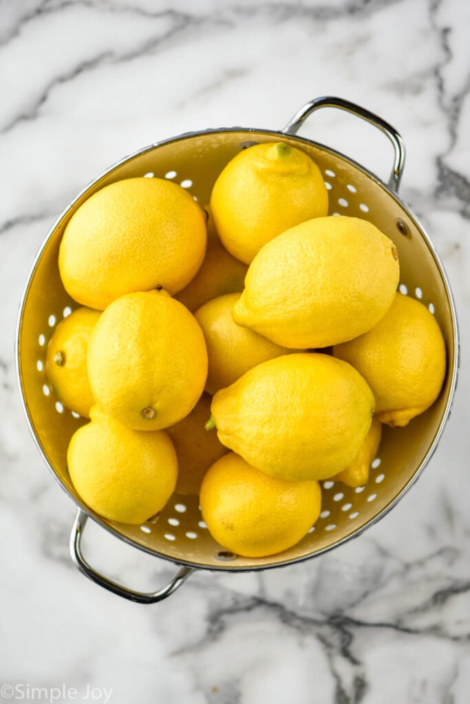 Overhead view of Lemons in a colander for Limoncello recipe.