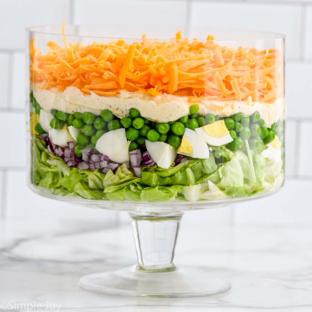 Trifle dish of Seven Layer Salad ingredients