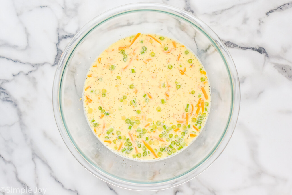 overhead of a mixing bowl full of quiche filling