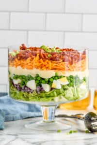 Trifle dish of Seven Layer Salad ingredients