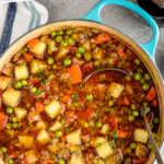 Pinterest graphic for Vegetable Beef Soup. Text says "the best Vegetable Beef Soup simplejoy.com" Image shows overhead of a soup pot of Vegetable Beef Soup with a ladle.