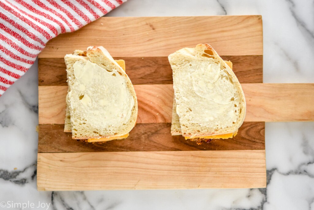 overhead of meatloaf sandwich ingredients on wooden cutting board