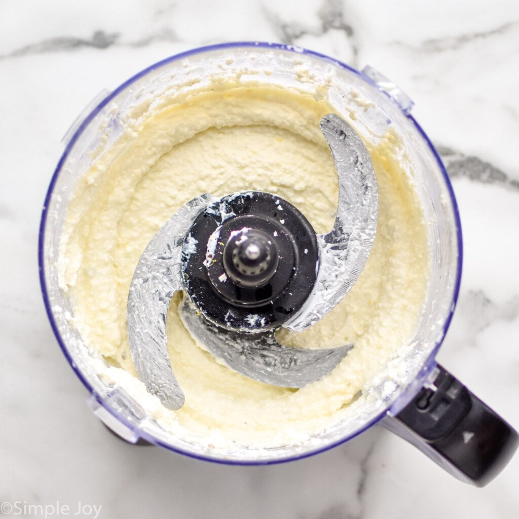 overhead of food processor of Whipped Feta Dip ingredients