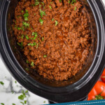 Pinterest graphic for Slow Cooker Taco Meat recipe. Image is overhead view of Slow Cooker Taco Meat recipe in a crock pot. Text says, "3 ingredient crockpot taco meat simplejoy.com."