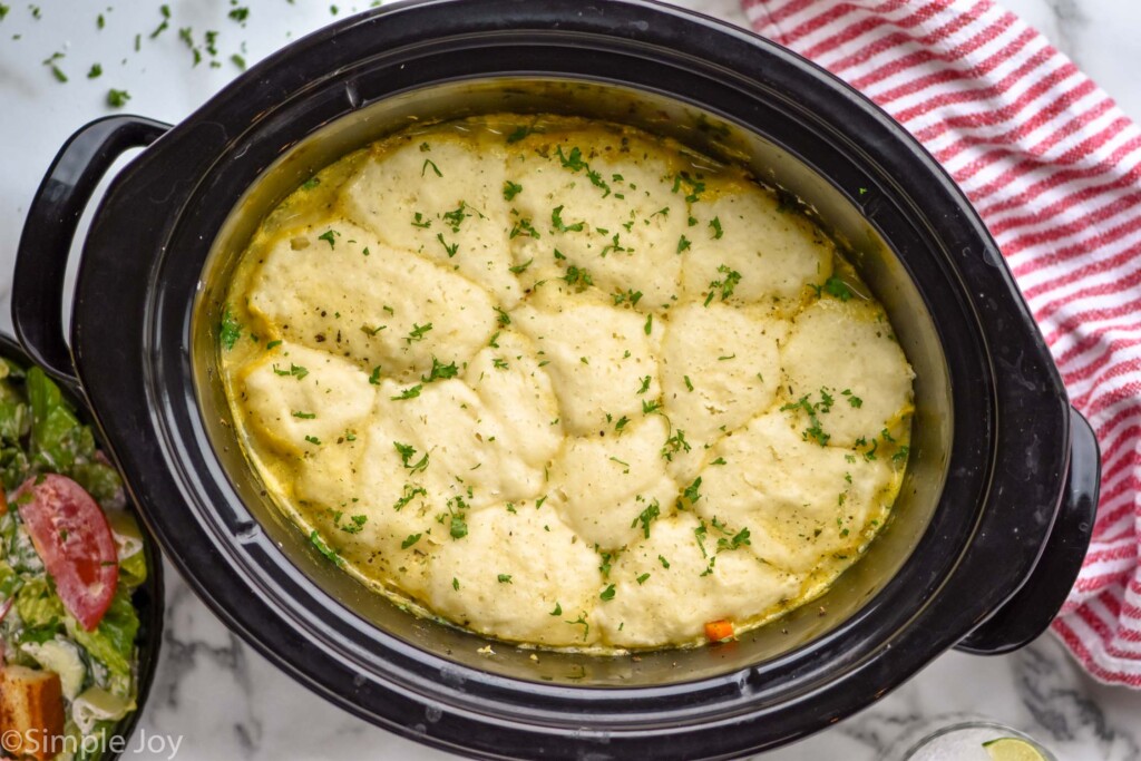 Overhead view of Crockpot Chicken and Dumplings recipe cooking in a crock pot