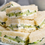 plate of cut cucumber sandwiches