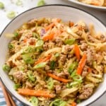 Bowl of Egg Roll in a Bowl with chop sticks beside.