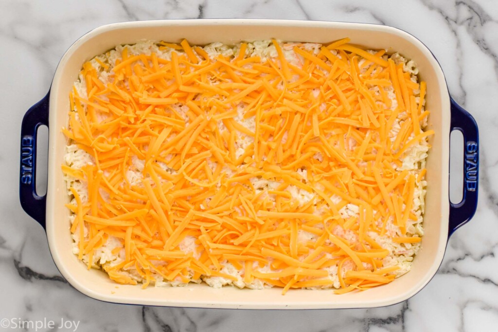 Overhead view of a casserole dish of hashbrown casserole recipe before baking