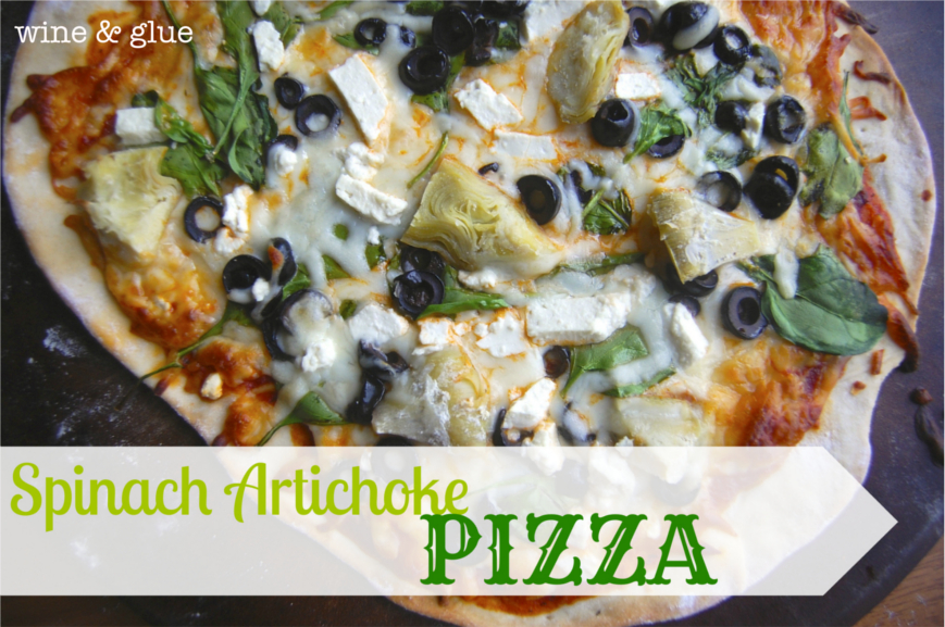 Spinach Artichoke Pizza with olives, artichoke hearts, spinach, and feta cheese. 