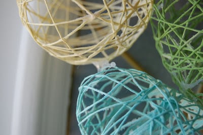 close up of embroidery floss eggs 