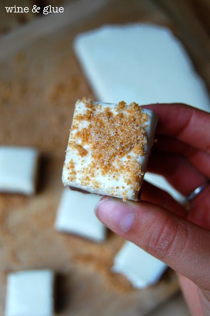 S'mores Fudge with a graham cracker crust and delicious marshmallow fudge topping sandwiching delicious chocolate fudge! via www.wineandglue.com
